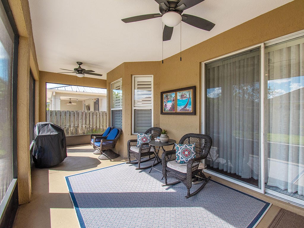 119 Amherst Lane Sebastian, FL 32958 - Photo 31 of 35 a living room with furniture a window and a chandelier