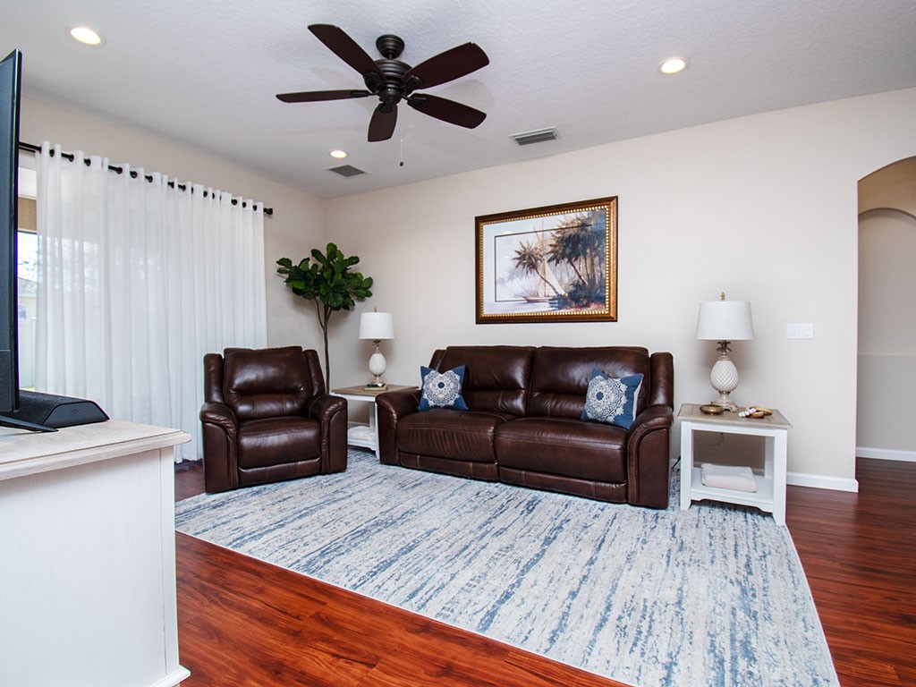 119 Amherst Lane Sebastian, FL 32958 - Photo 4 of 35 a living room with furniture and a wooden floor