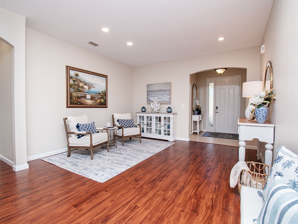119 Amherst Lane Sebastian, FL 32958 - Photo 6 of 35 a living room with furniture and a wooden floor