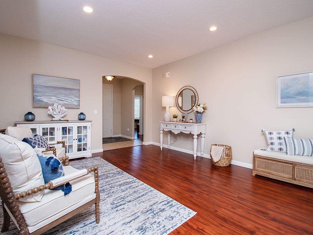 119 Amherst Lane Sebastian, FL 32958 - Photo 7 of 35 a living room with furniture and a wooden floor