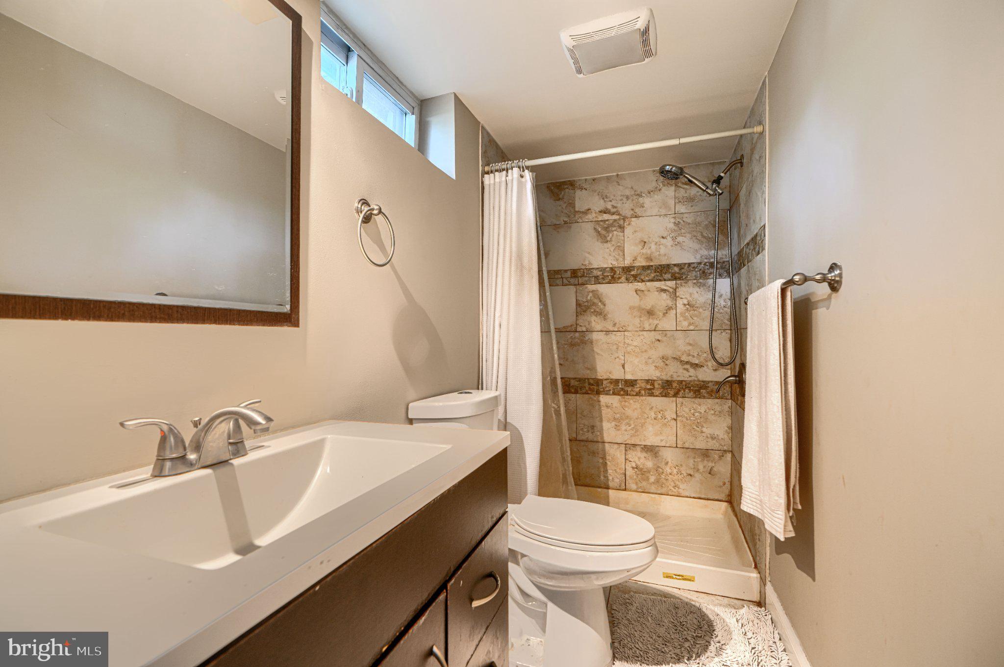 3708 Cassen Road Randallstown, MD 21133 - Photo 32 of 38 a bathroom with a sink toilet and shower