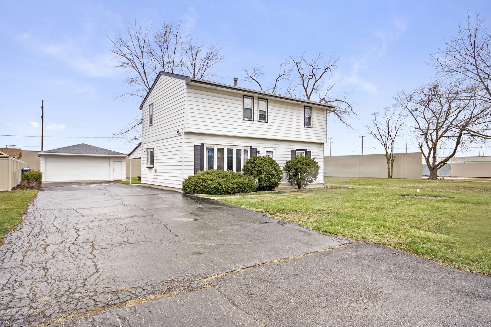 7506 Ferdinand Avenue Bridgeview, IL 60455 - Photo 1 of 14 a front view of a house with garden