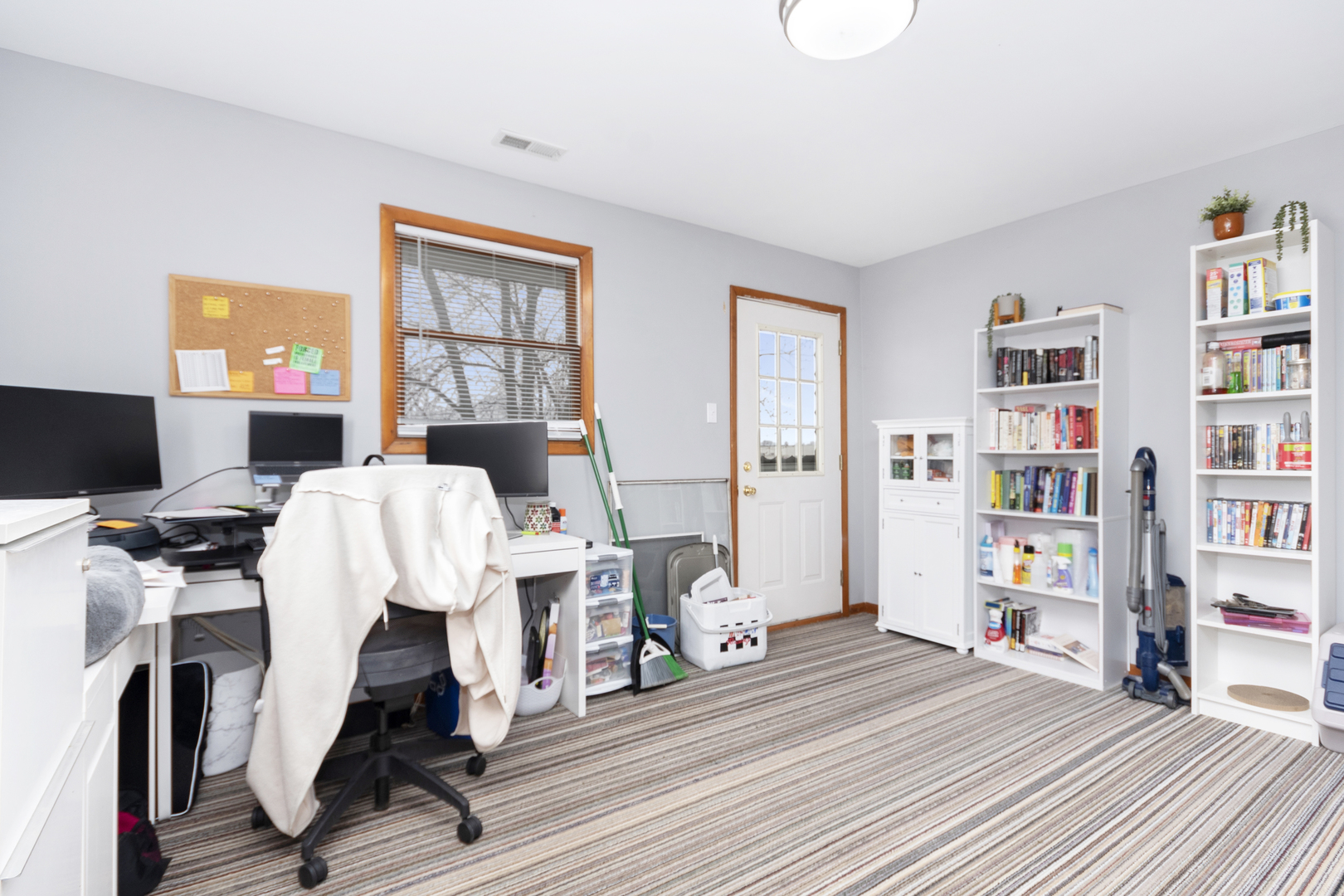 7506 Ferdinand Avenue Bridgeview, IL 60455 - Photo 14 of 14 a view of a workspace with furniture and bedroom