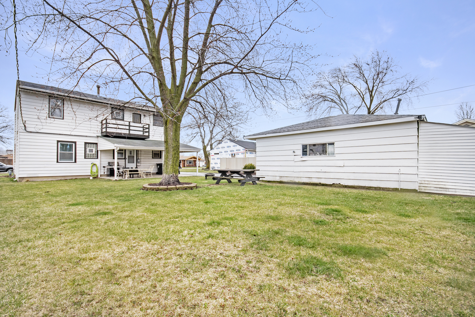 7506 Ferdinand Avenue Bridgeview, IL 60455 - Photo 2 of 14 a front view of a house with a garden
