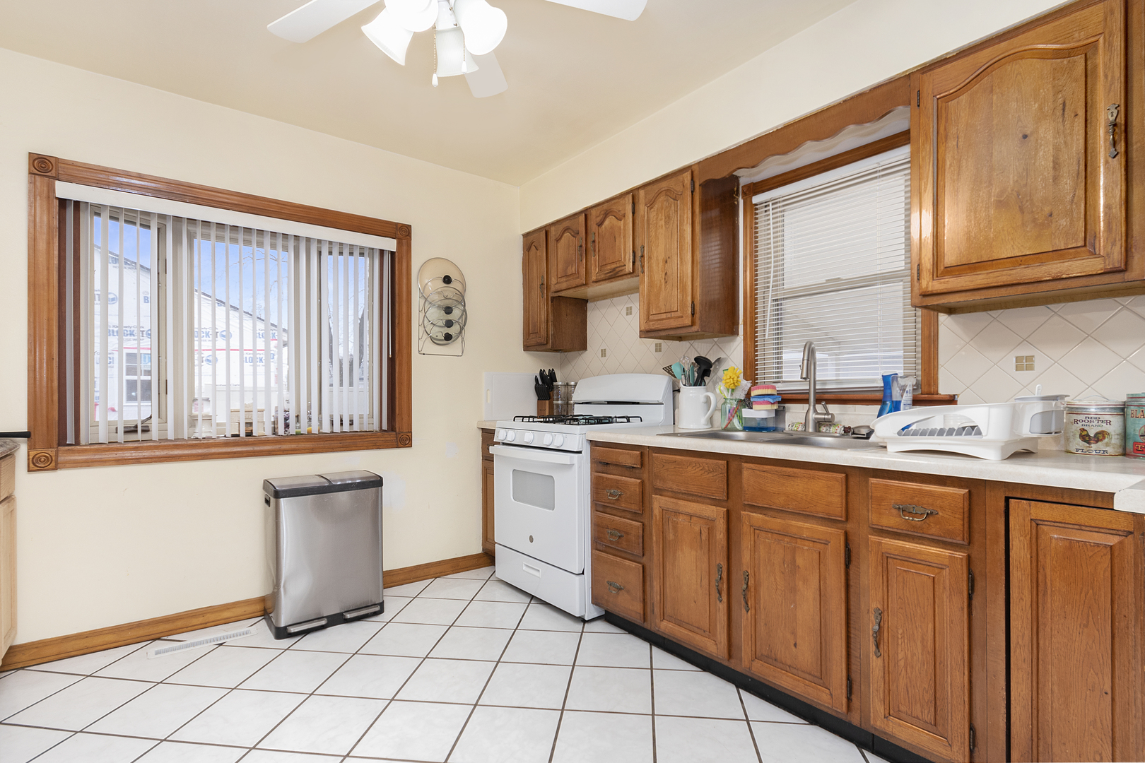 7506 Ferdinand Avenue Bridgeview, IL 60455 - Photo 6 of 14 a kitchen with a sink cabinets and window