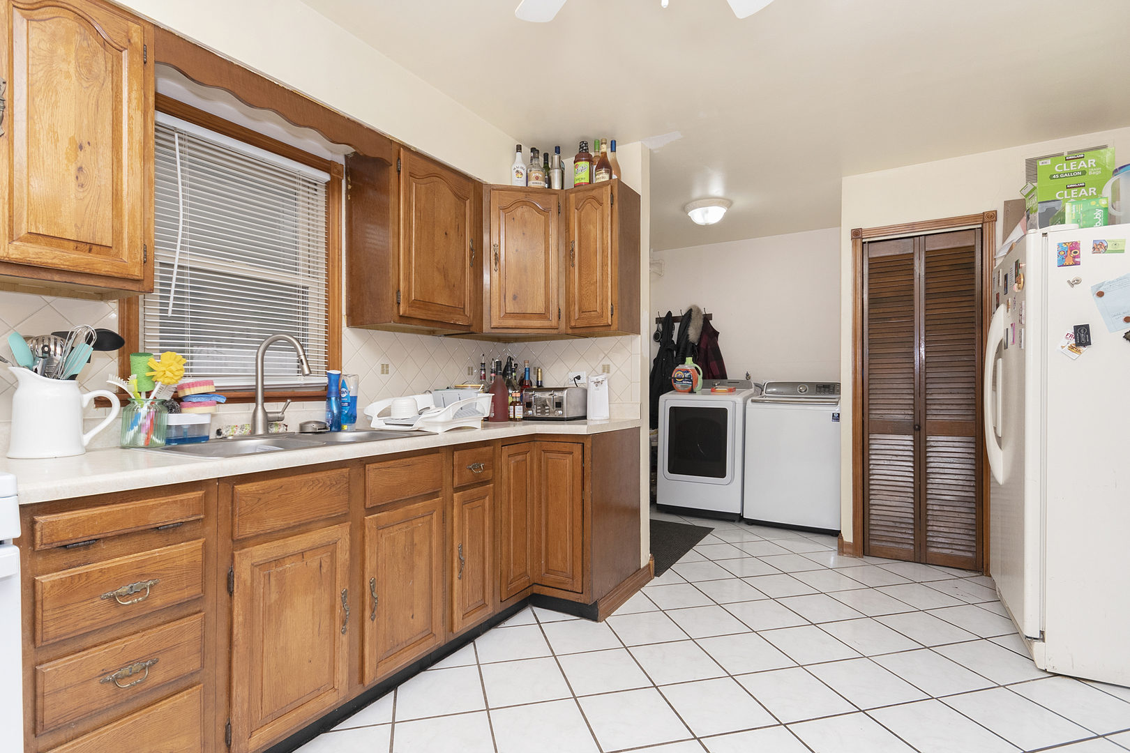 7506 Ferdinand Avenue Bridgeview, IL 60455 - Photo 7 of 14 a kitchen with granite countertop a sink cabinets and stainless steel appliances