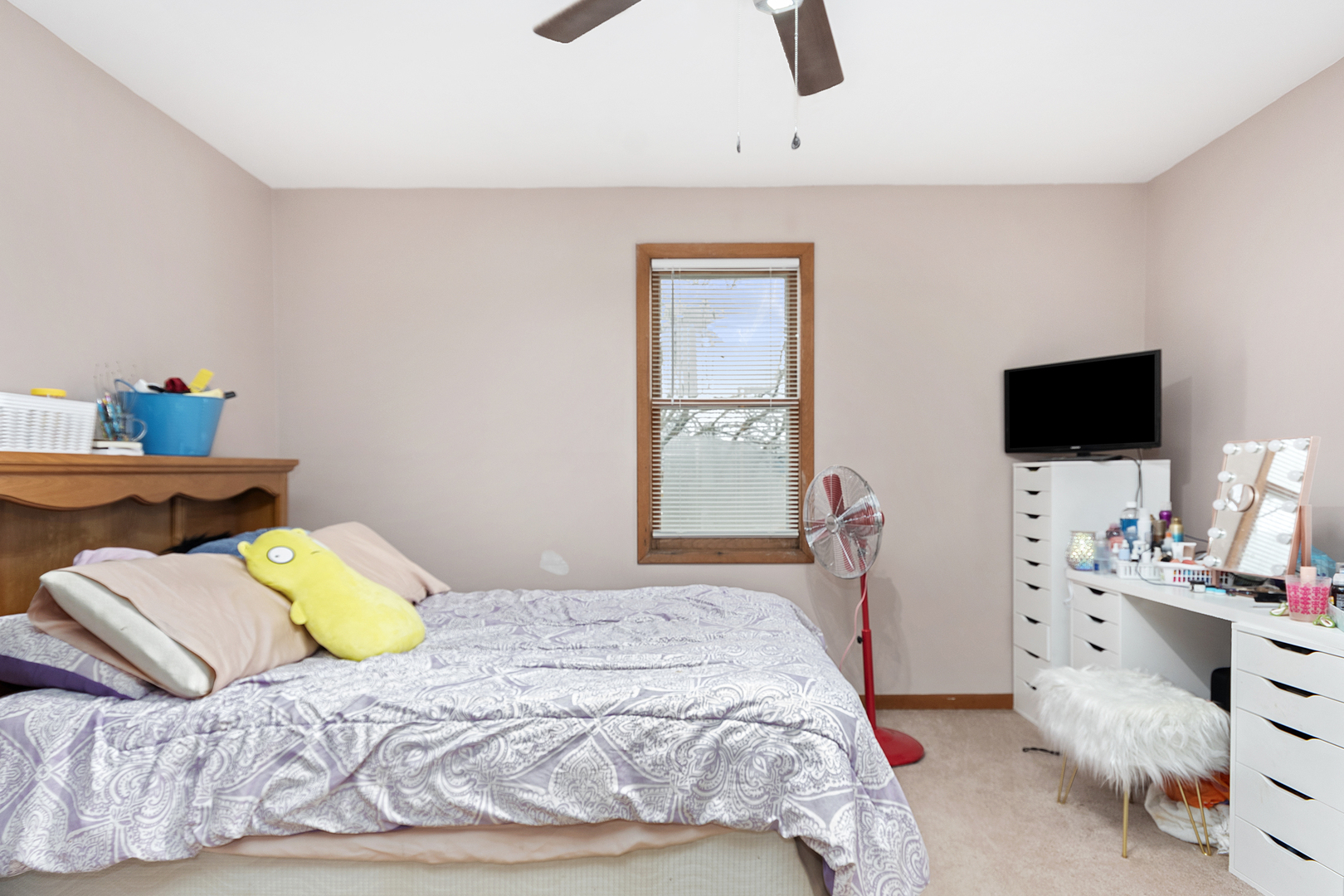 7506 Ferdinand Avenue Bridgeview, IL 60455 - Photo 10 of 14 a bedroom with a bed and flat tv screen on the dresser