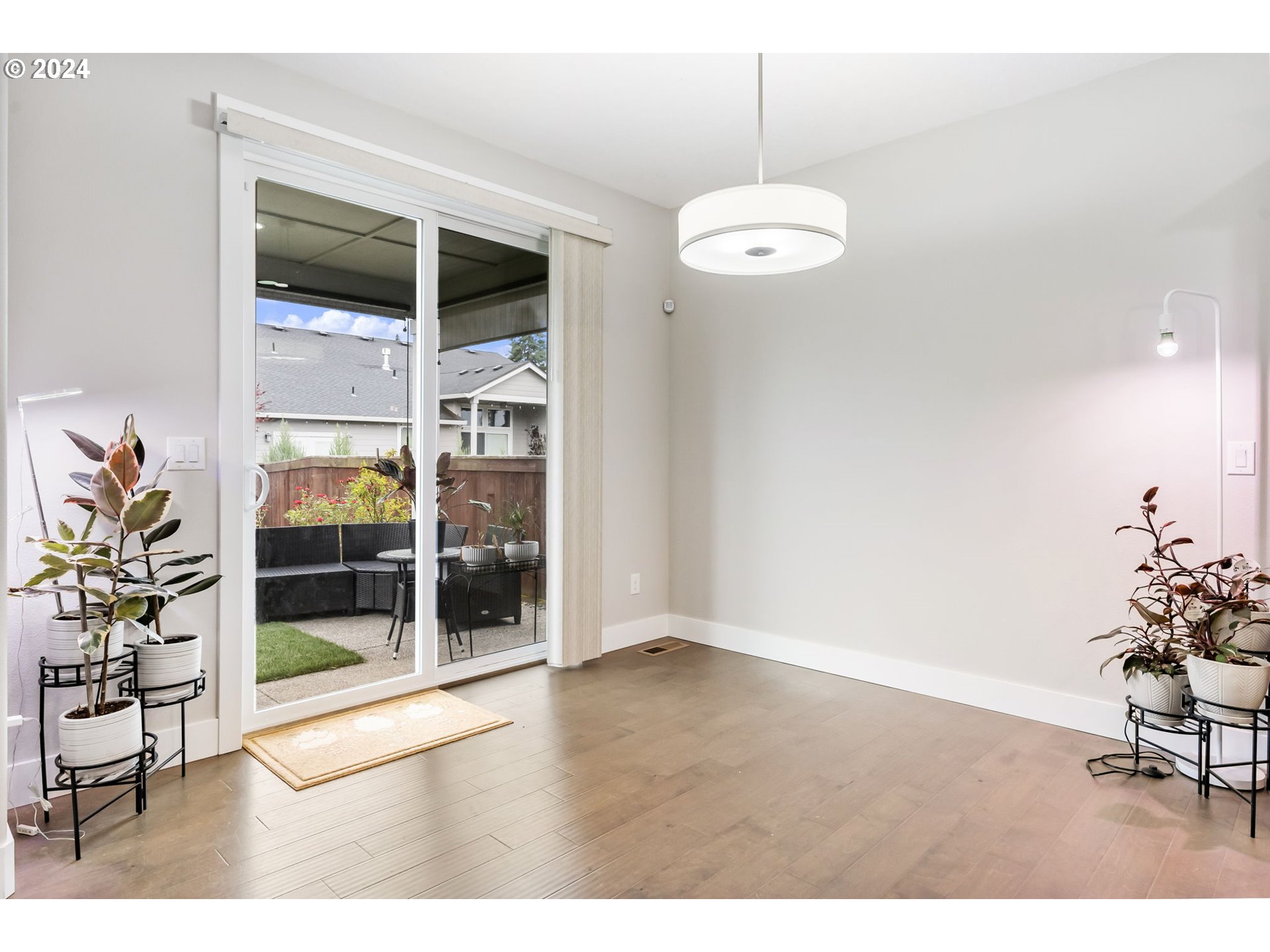 1838 South 46th Place Ridgefield, WA 98642 - Photo 14 of 47 a view of a room with wooden floor and windows