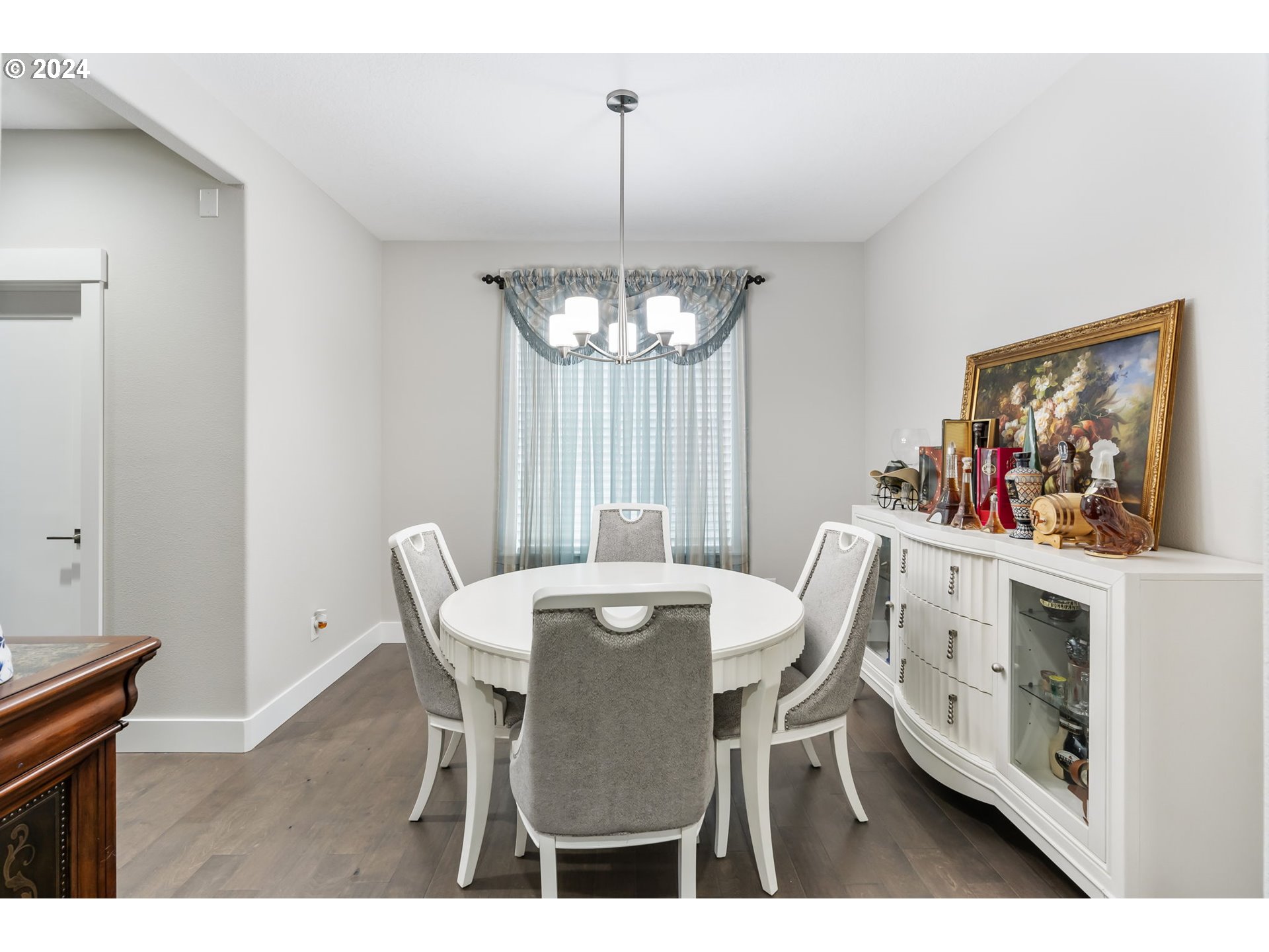 1838 South 46th Place Ridgefield, WA 98642 - Photo 15 of 47 a view of a dining room with furniture and chandelier