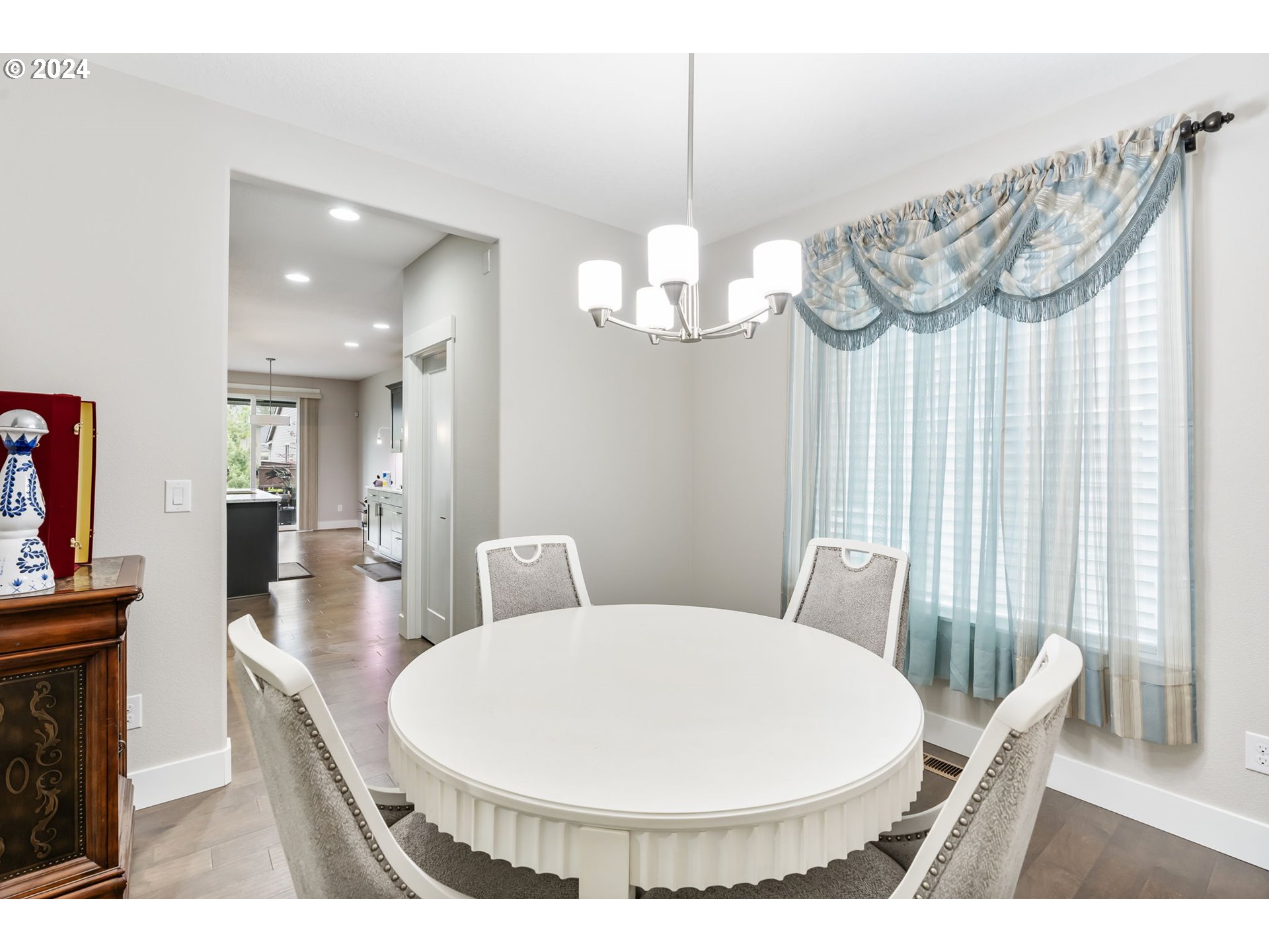1838 South 46th Place Ridgefield, WA 98642 - Photo 16 of 47 a view of a dining room with furniture and wooden floor
