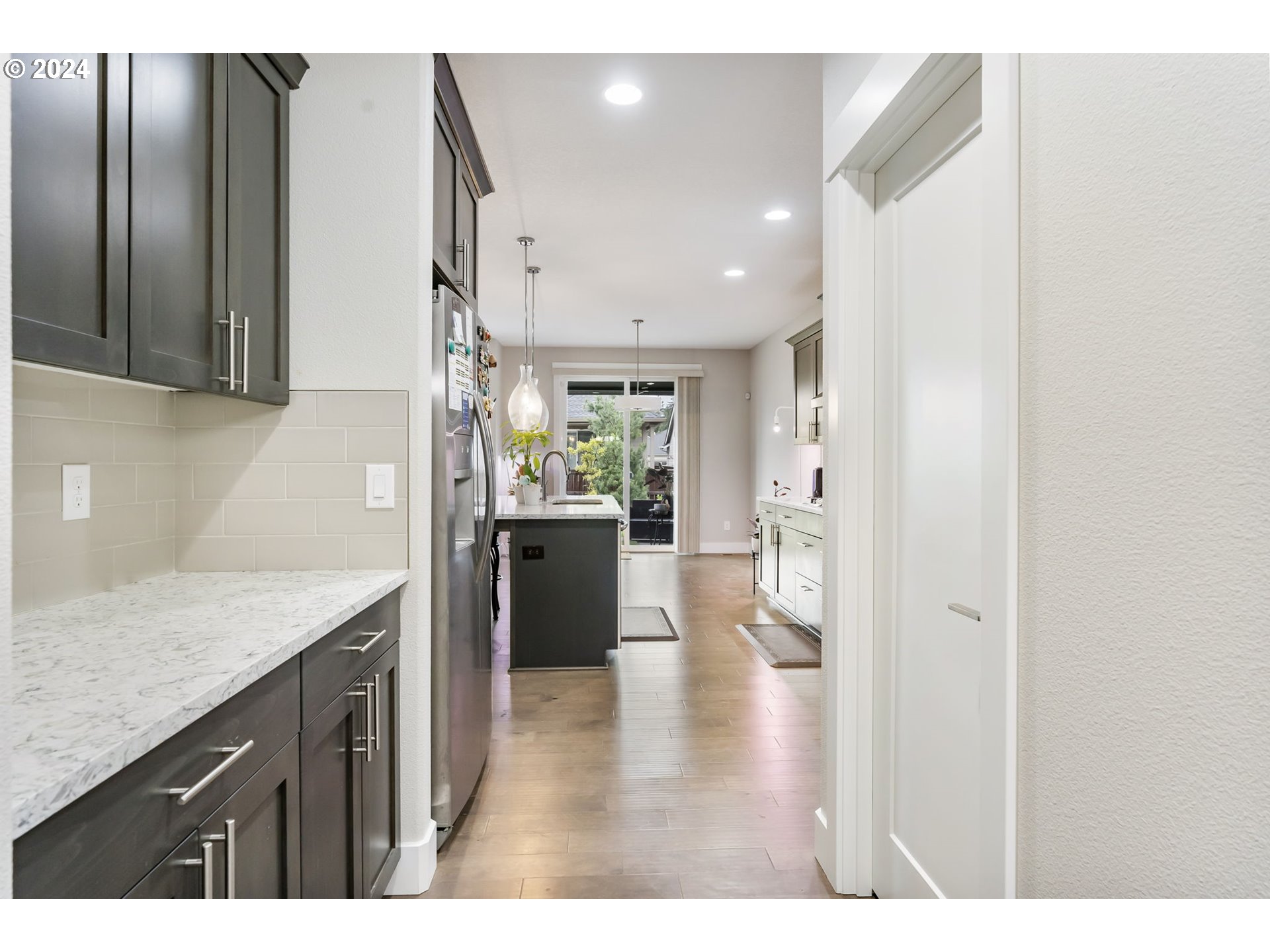 1838 South 46th Place Ridgefield, WA 98642 - Photo 17 of 47 a kitchen with a refrigerator and a sink