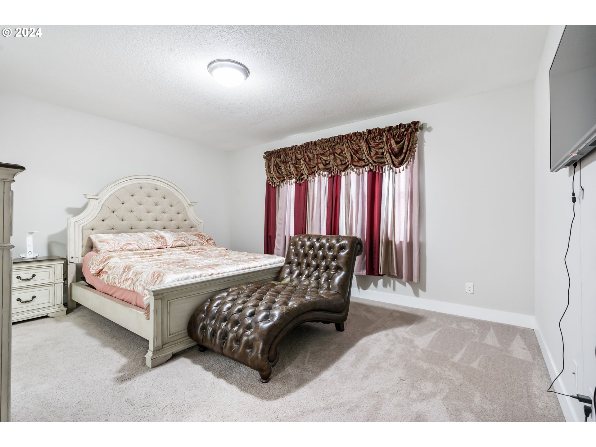 1838 South 46th Place Ridgefield, WA 98642 - Photo 18 of 47 a bed sitting in a bedroom next to a window
