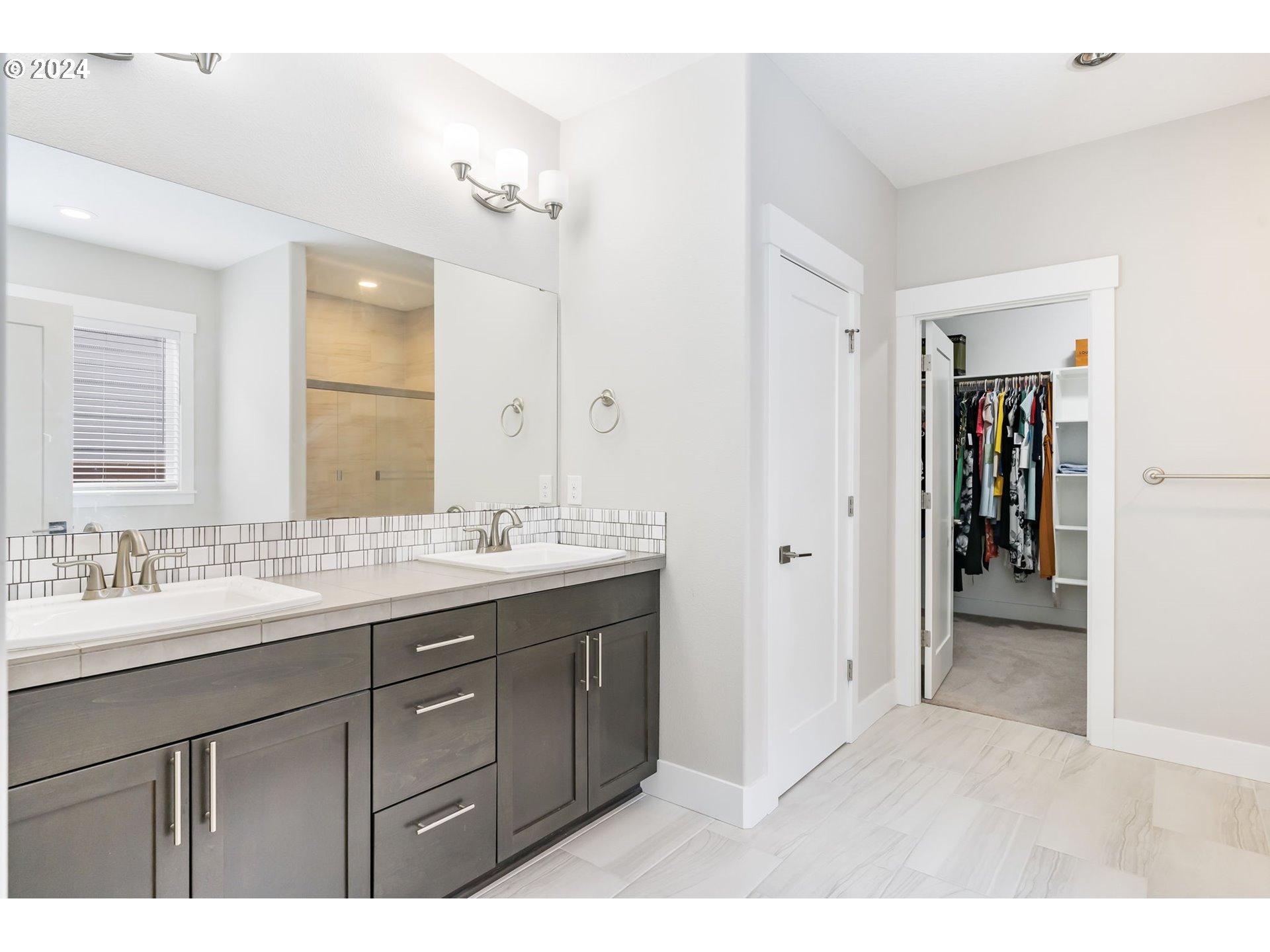 1838 South 46th Place Ridgefield, WA 98642 - Photo 20 of 47 a bathroom with a granite countertop sink mirror and