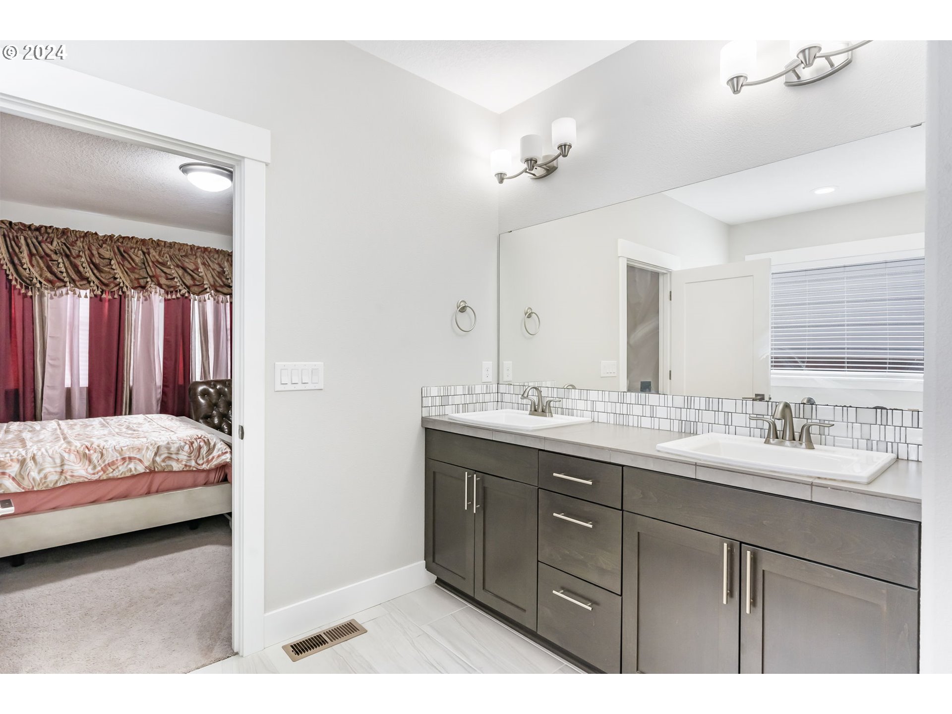 1838 South 46th Place Ridgefield, WA 98642 - Photo 22 of 47 a en suite bathroom with a sink double vanity and a mirror