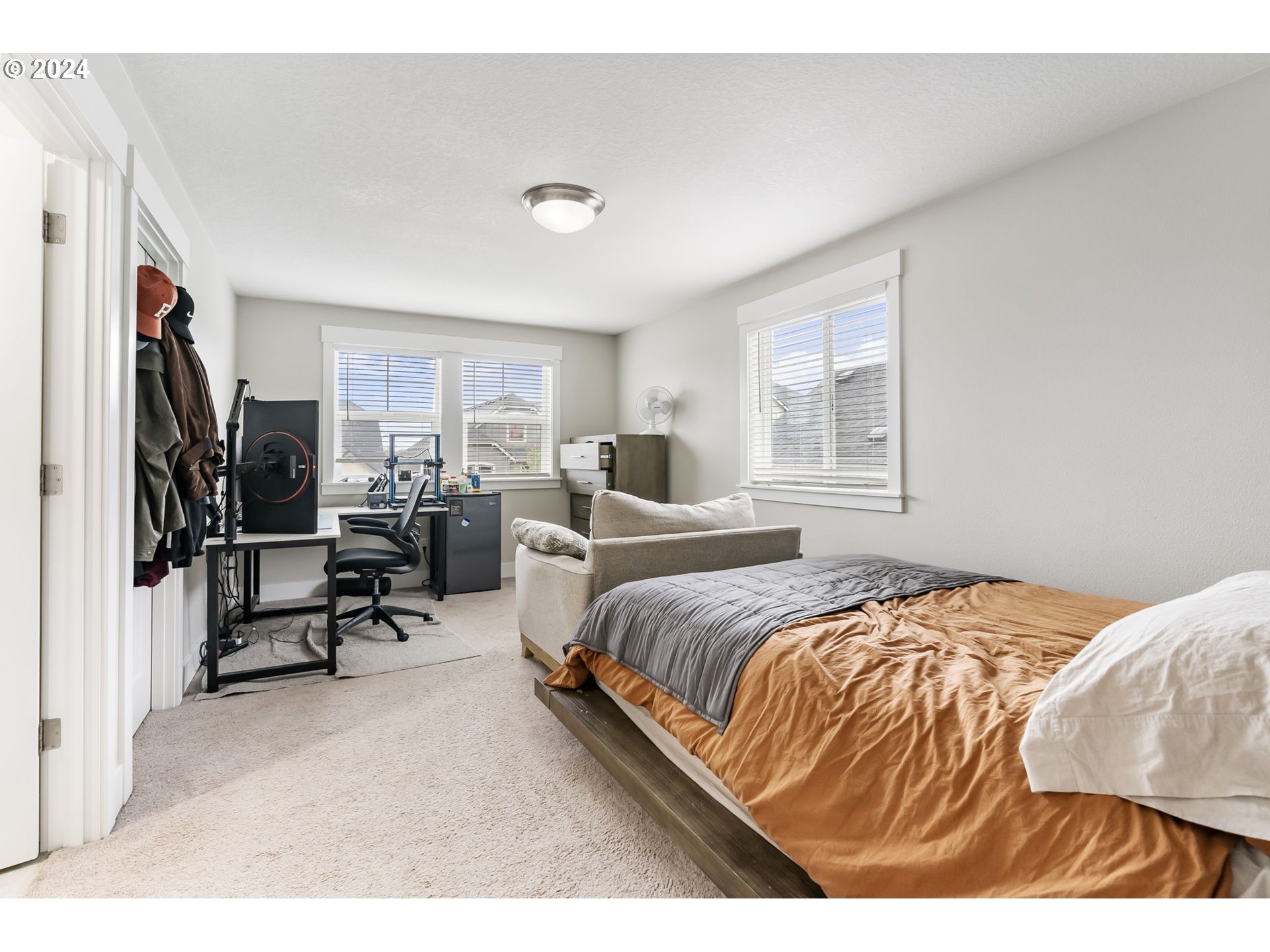 1838 South 46th Place Ridgefield, WA 98642 - Photo 31 of 47 a bedroom with a bed a couch and a window