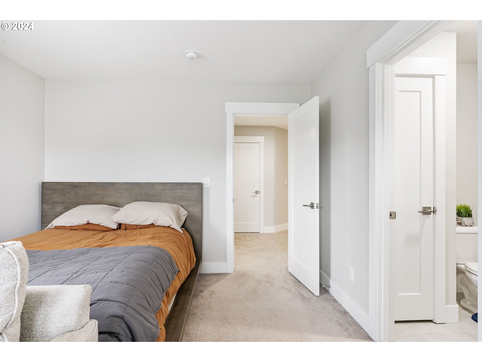 1838 South 46th Place Ridgefield, WA 98642 - Photo 32 of 47 a bedroom with a bed and a mirror