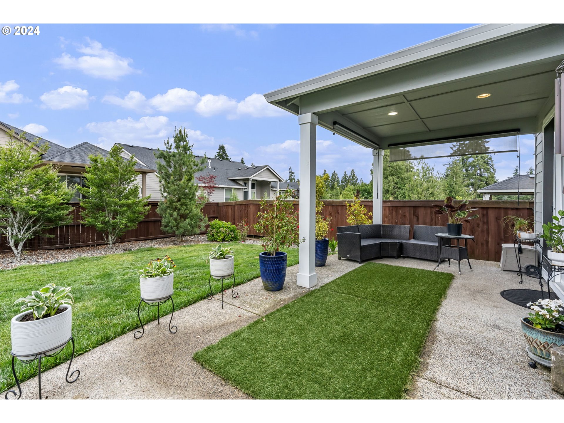 1838 South 46th Place Ridgefield, WA 98642 - Photo 39 of 47 a view of a porch with furniture and garden