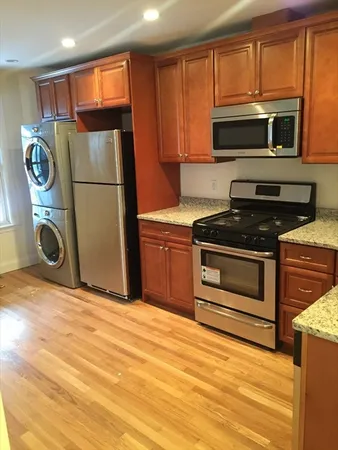 a kitchen with a stove microwave and refrigerator