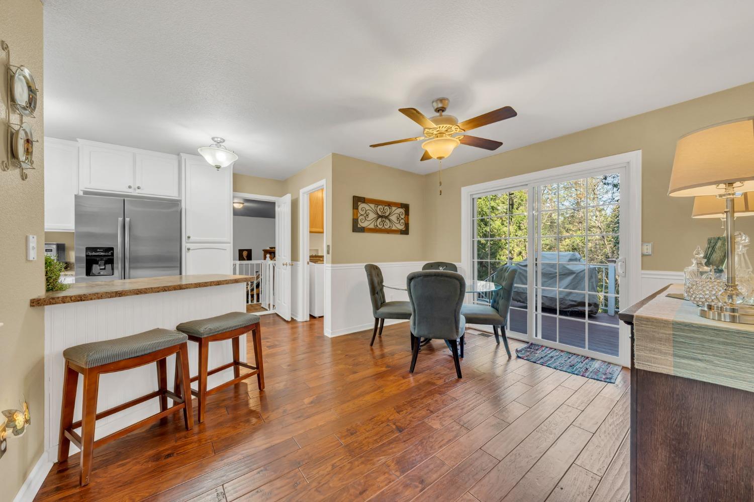 10092 Smith Road Grass Valley, CA 95949 - Photo 20 of 58 a view of a dining room with furniture window and wooden floor