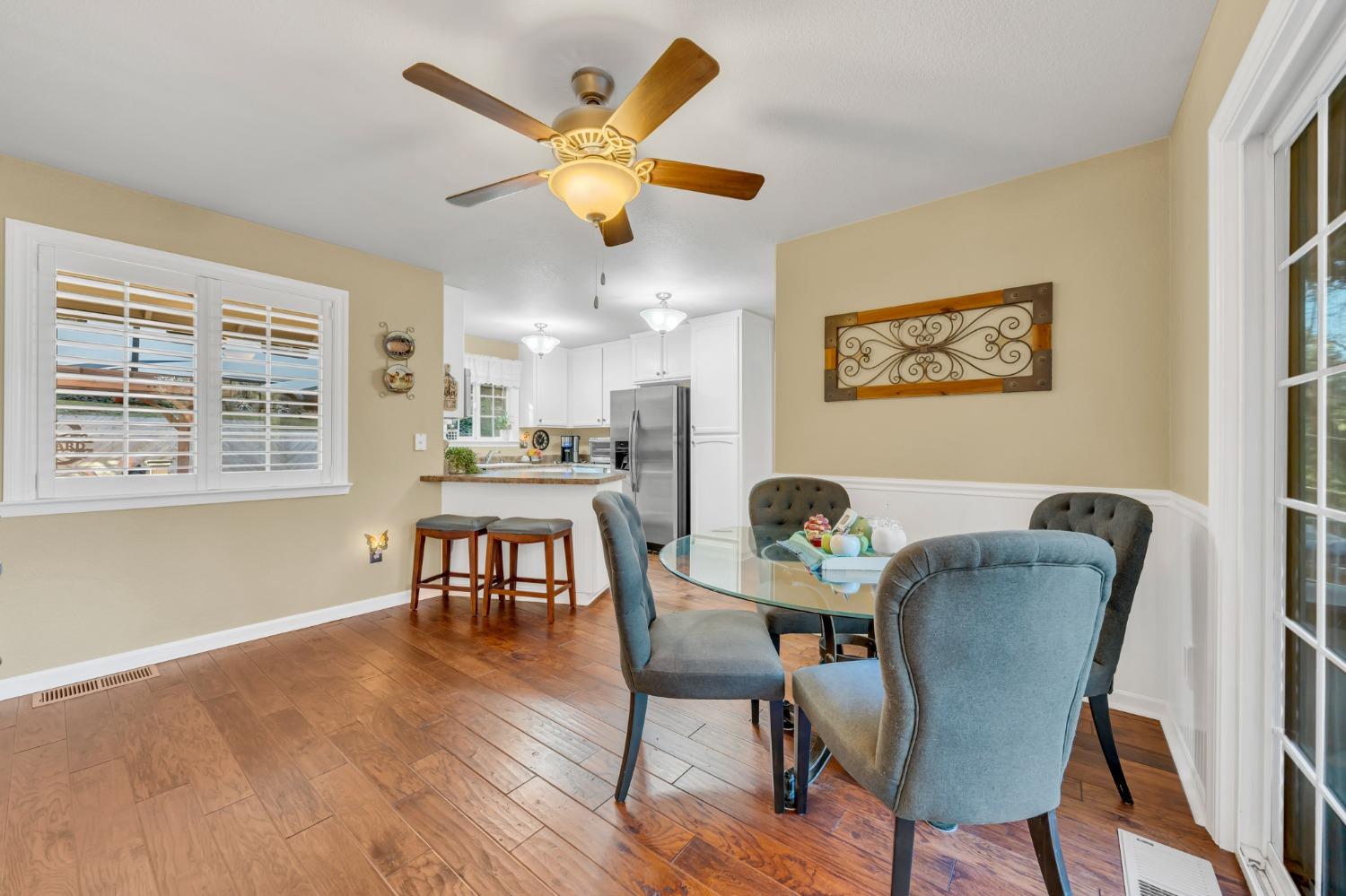 10092 Smith Road Grass Valley, CA 95949 - Photo 22 of 58 a view of a dining room with furniture and a large window