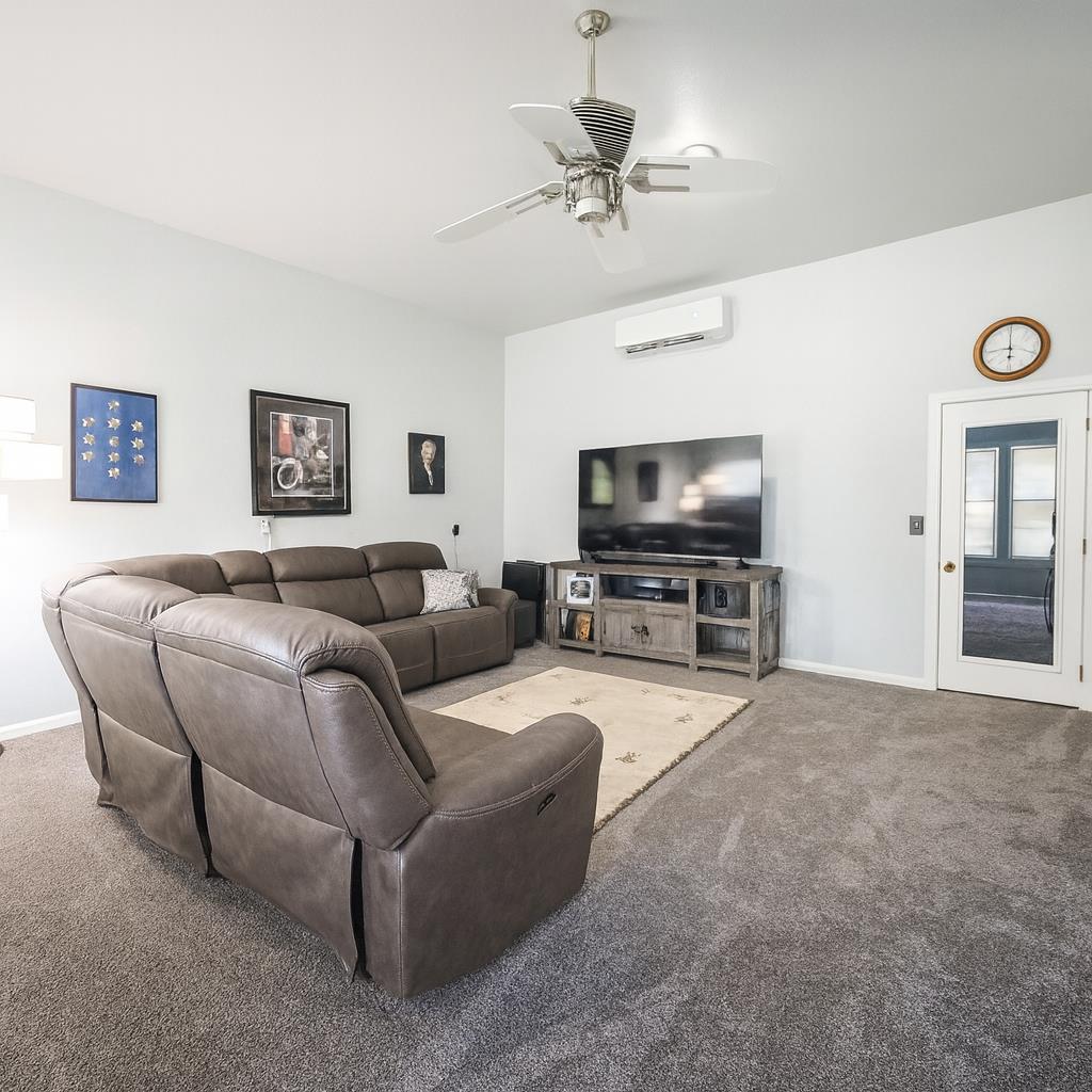 10092 Smith Road Grass Valley, CA 95949 - Photo 30 of 58 a living room with furniture and a flat screen tv