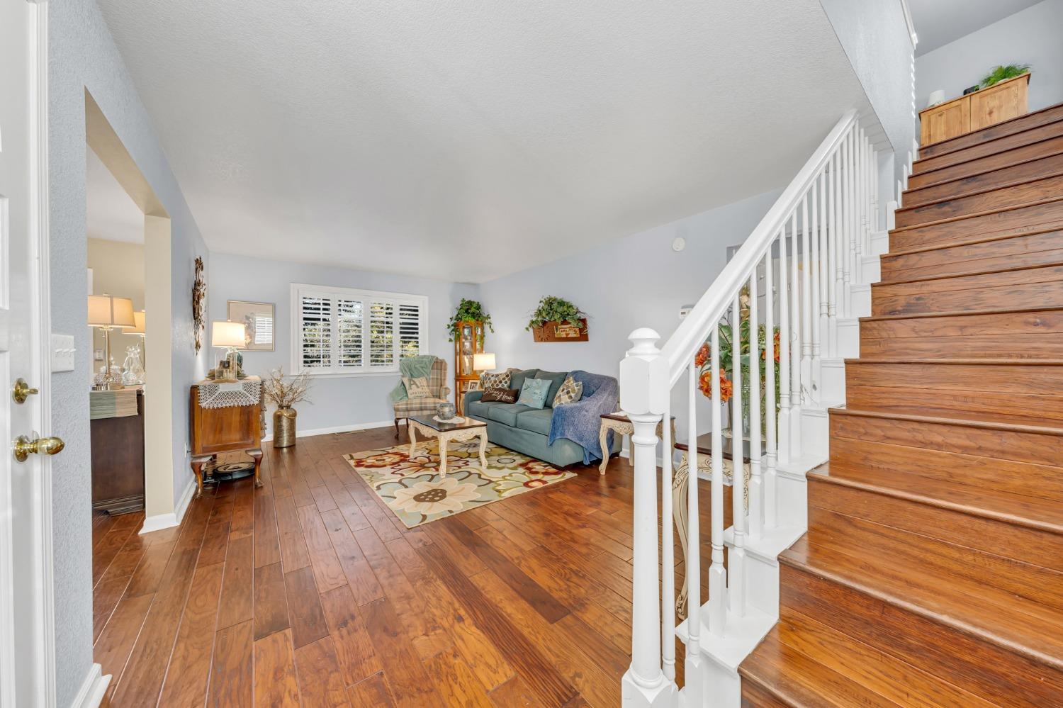 10092 Smith Road Grass Valley, CA 95949 - Photo 35 of 58 a view of a livingroom with wooden floor and stairs