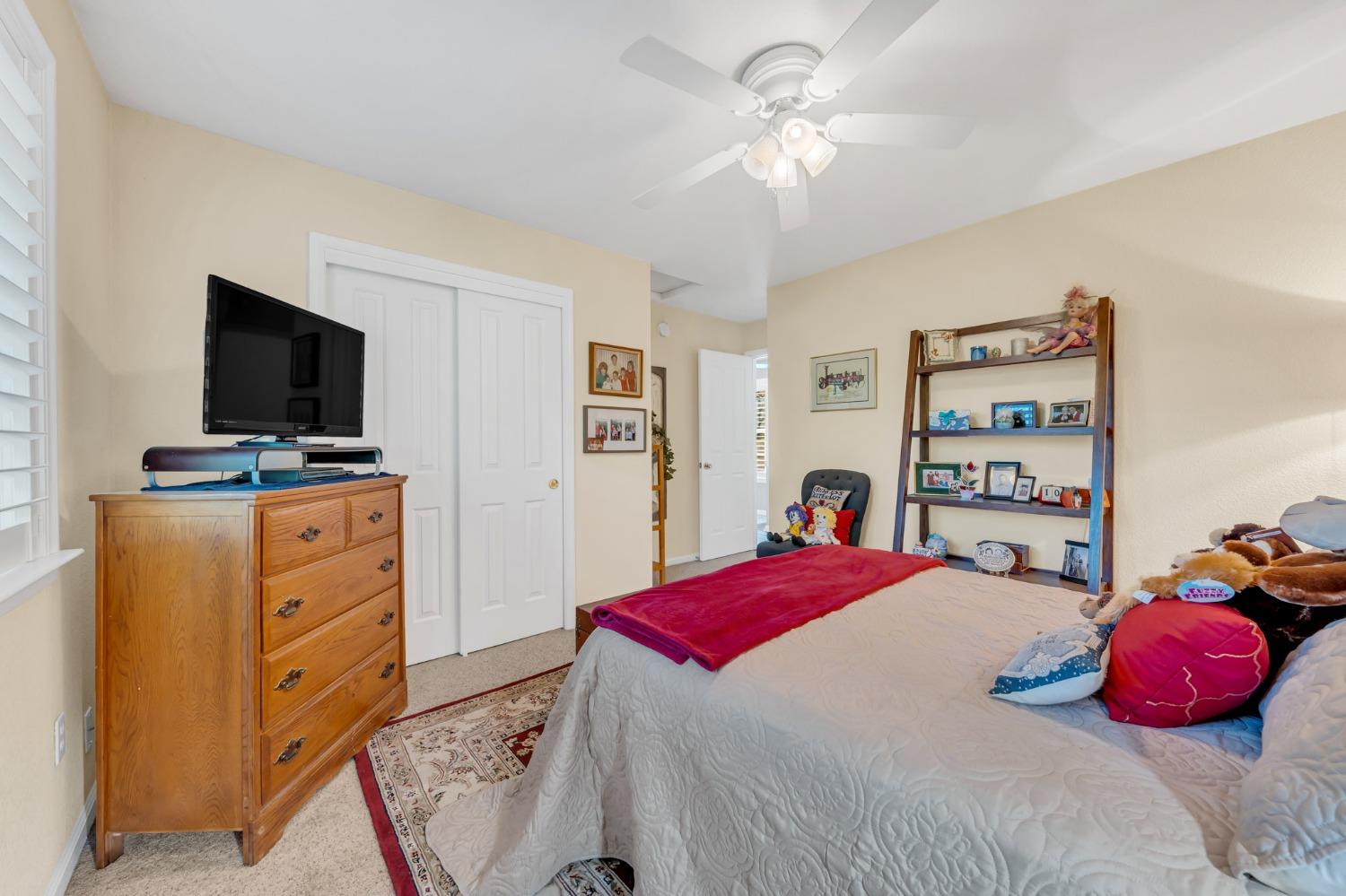 10092 Smith Road Grass Valley, CA 95949 - Photo 43 of 58 a bedroom with a bed and a flat screen tv