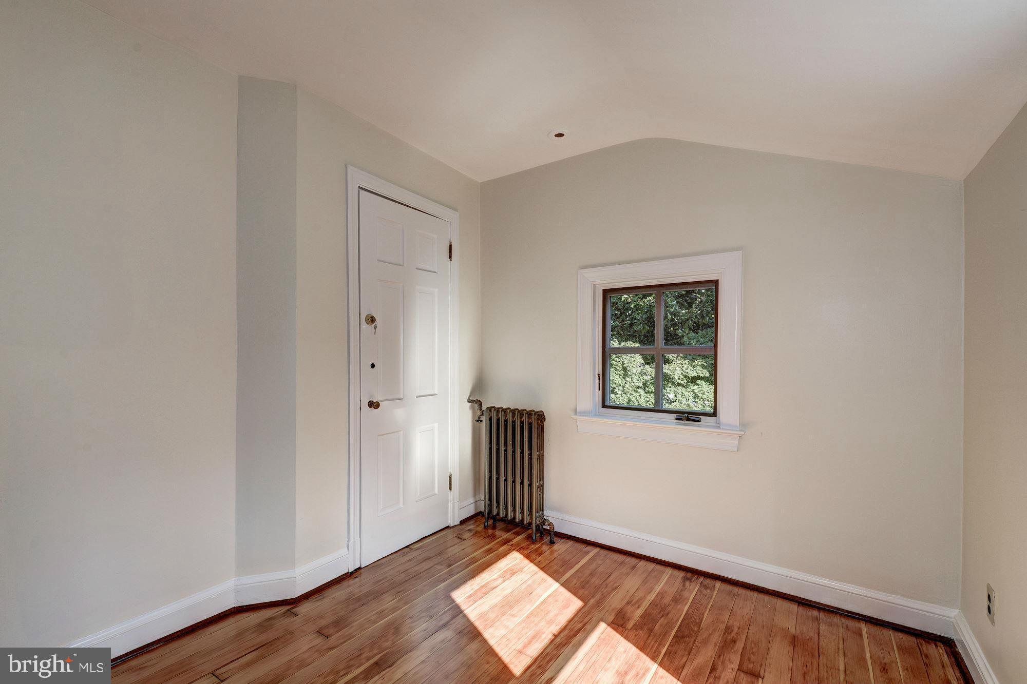 3217 Volta Place Northwest Washington, DC 20007 - Photo 13 of 21 a view of an empty room with wooden floor