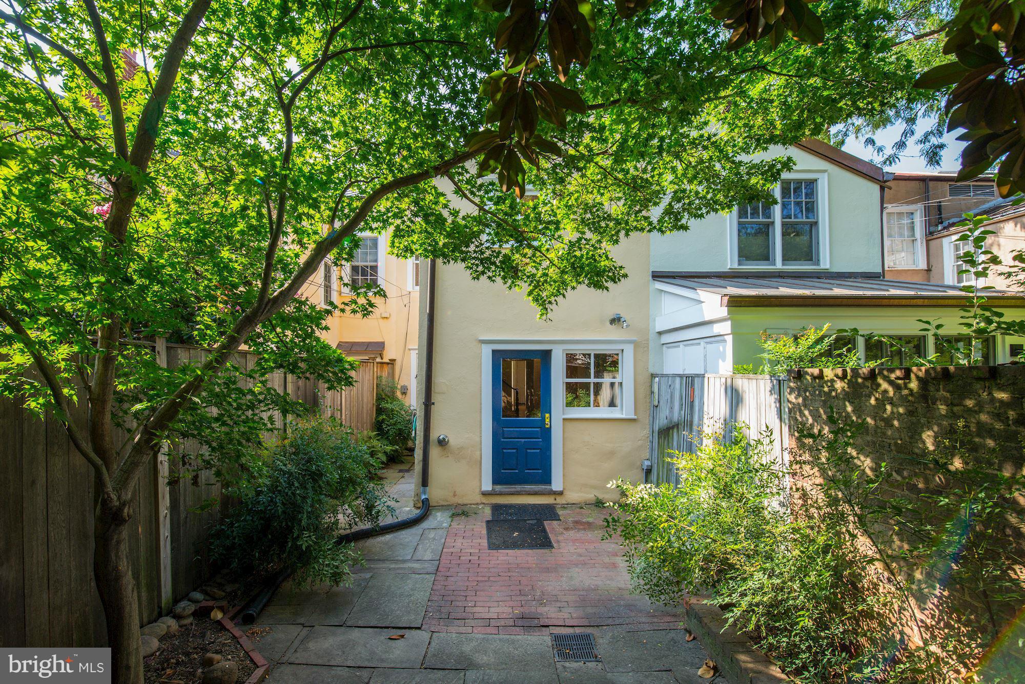 3217 Volta Place Northwest Washington, DC 20007 - Photo 17 of 21 a front view of a house with garden