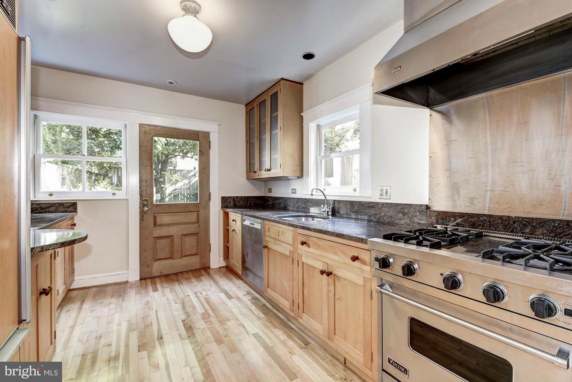 3217 Volta Place Northwest Washington, DC 20007 - Photo 7 of 21 a kitchen with granite countertop a stove and a sink