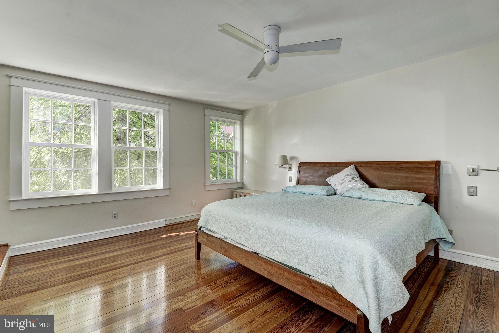 3217 Volta Place Northwest Washington, DC 20007 - Photo 10 of 21 a large bed sitting in a bedroom next to a window