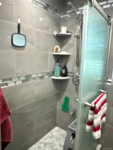 a bathroom with a sink and a shower
