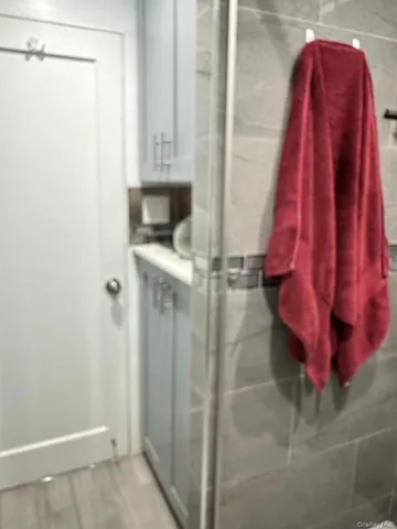 a bathroom with a shower curtain and a sink