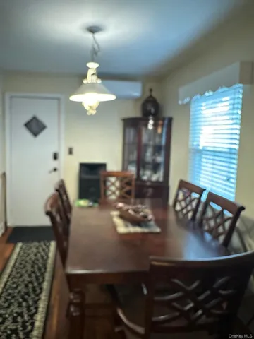 a dining room with furniture and a chandelier