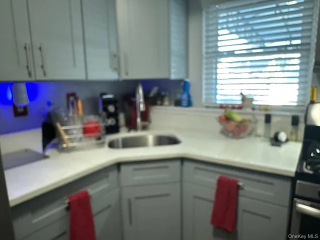 a kitchen with a sink and a window