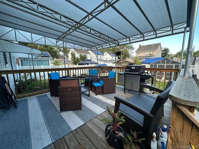 a view of a chairs and table in the balcony