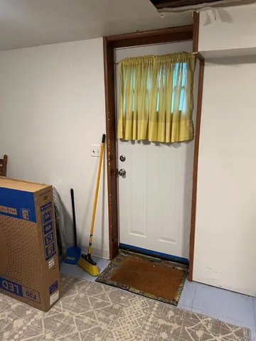 a view of an entryway with a table