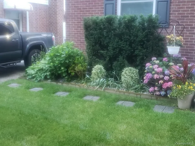 a small yard with fountain in the back yard