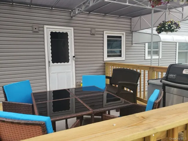 a backyard of a house with seating space