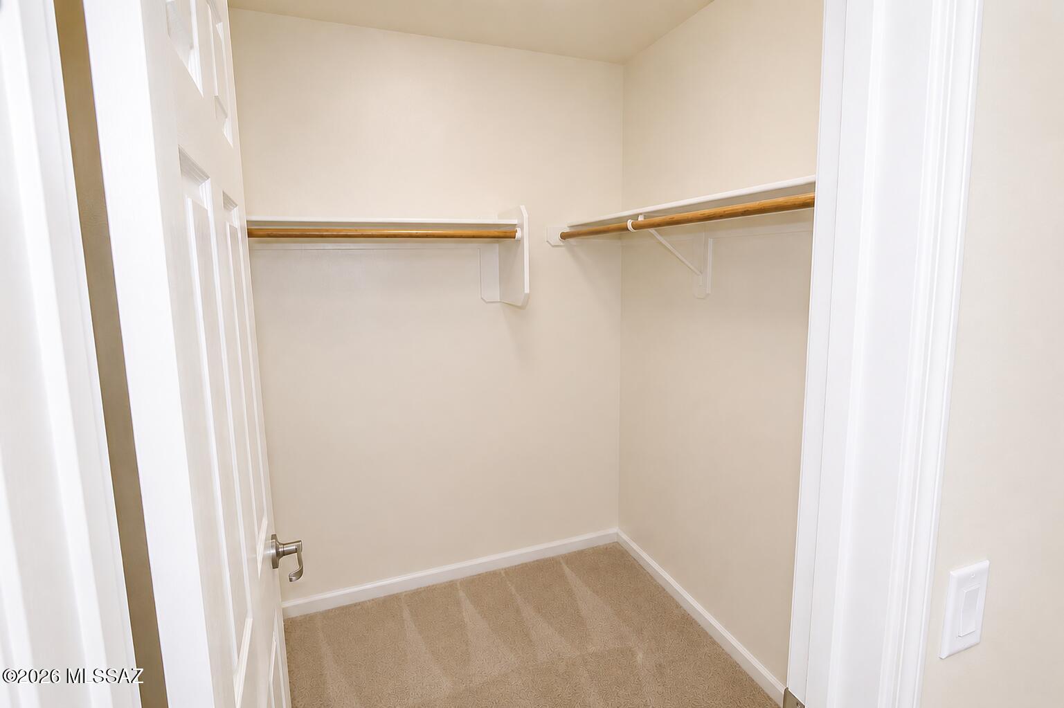 11484 East Desert Raptor Loop Tucson, AZ 85747 - Photo 12 of 28 a view of walk in closet with empty racks