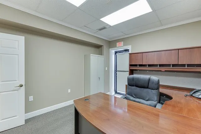 a livingroom with a workspace