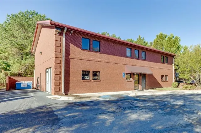 a view of a house with a street