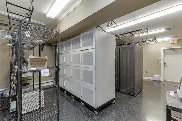 a view of a refrigerator in kitchen and wooden floor