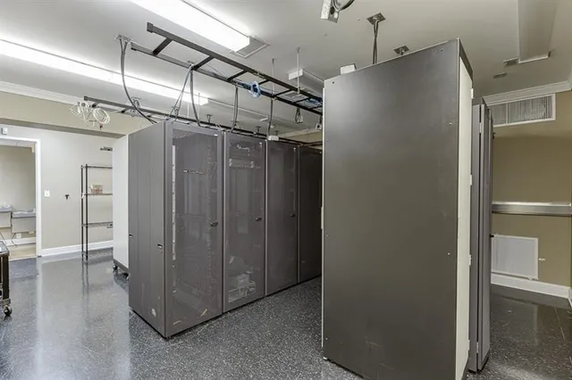 a view of walk in closet with clothes