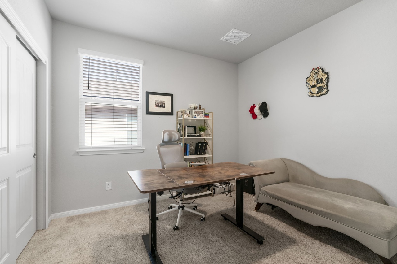 212 Apache Plum Drive Kyle, TX 78640 - Photo 16 of 21 Office area with light carpet and baseboards