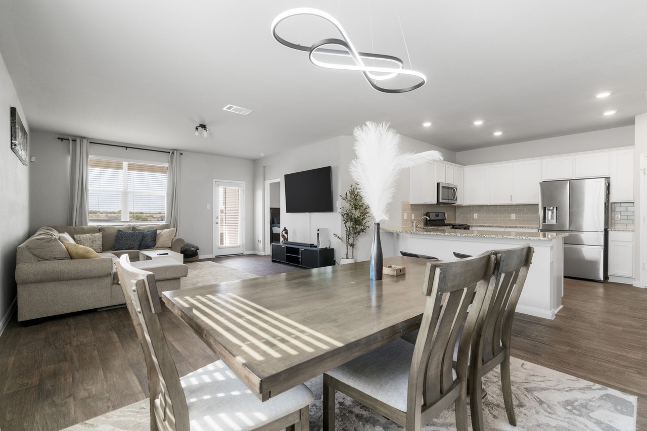 212 Apache Plum Drive Kyle, TX 78640 - Photo 5 of 21 Dining room with dark wood-style flooring and recessed lighting