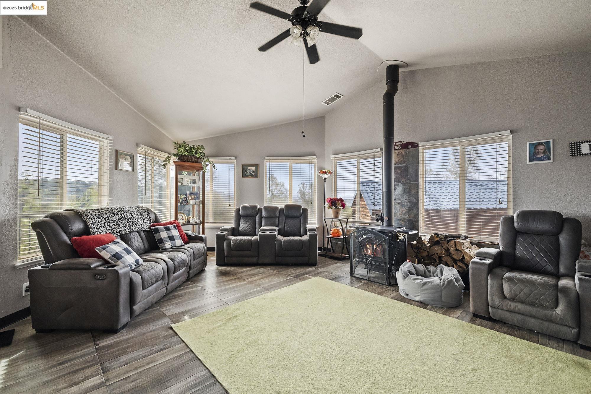 20588 Upper Hillview Drive Sonora, CA 95370 - Photo 7 of 42 a living room with furniture ceiling fan and a window