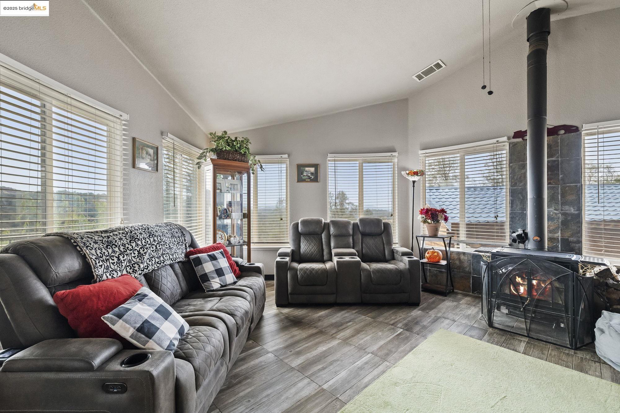 20588 Upper Hillview Drive Sonora, CA 95370 - Photo 8 of 42 a living room with furniture and a large window