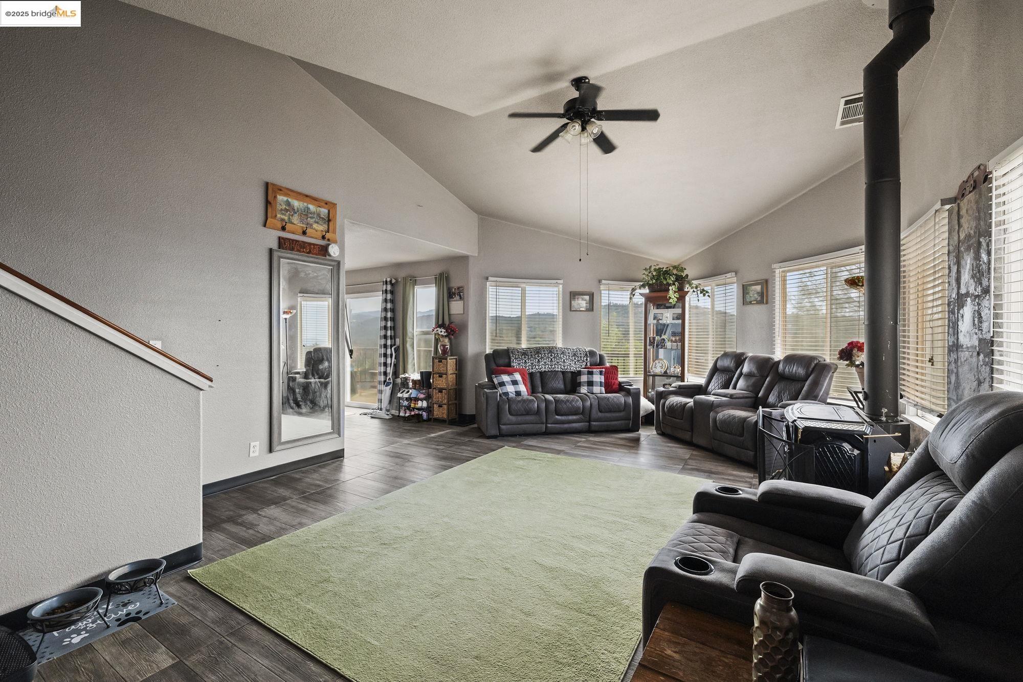 20588 Upper Hillview Drive Sonora, CA 95370 - Photo 9 of 42 a living room with furniture and a rug