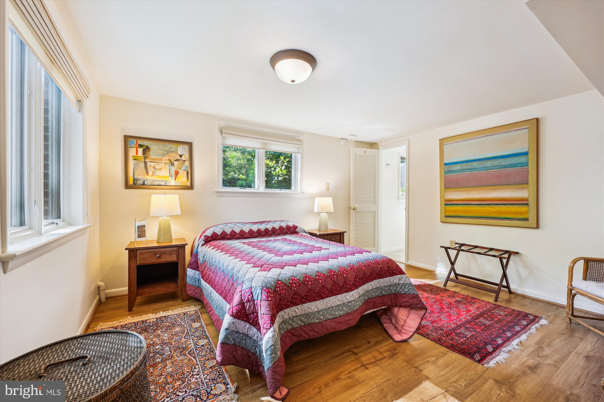 10606 Mantz Road Silver Spring, MD 20903 - Photo 45 of 72 a bedroom with a bed and wooden floor